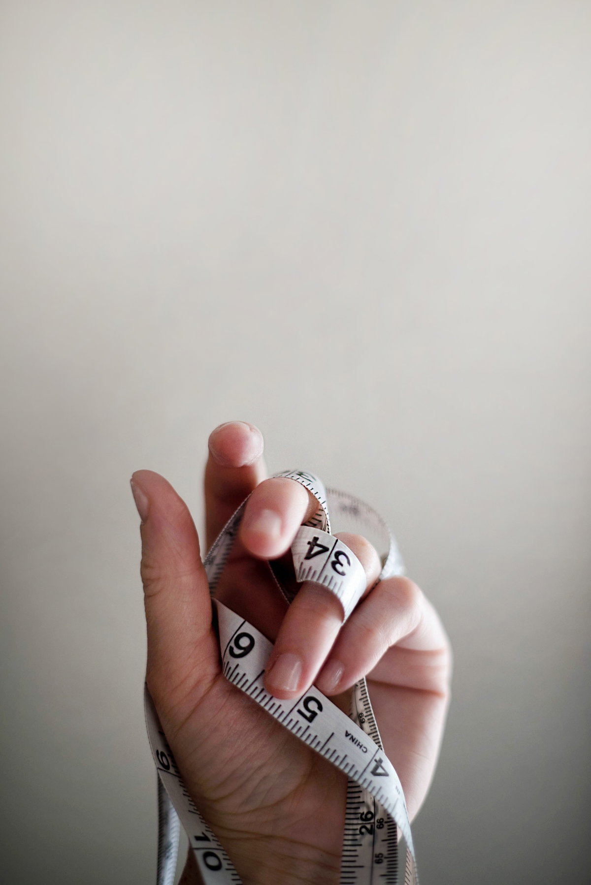 Maßband in Hand