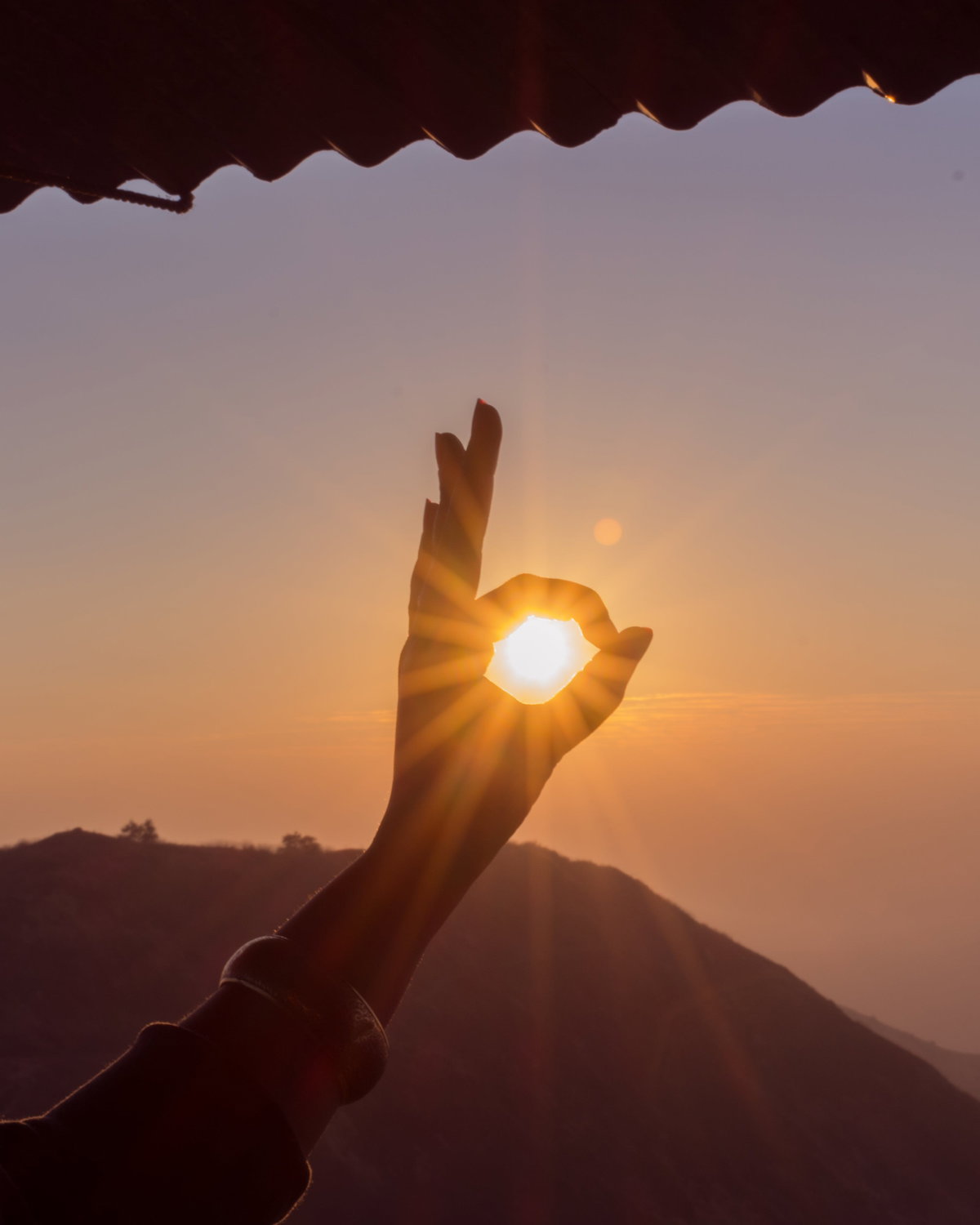 Sonne und Hand